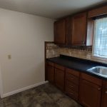 617 Clinton Kitchen with lots of counter space and cabinets on both sides. Tile floor and backsplashes.
